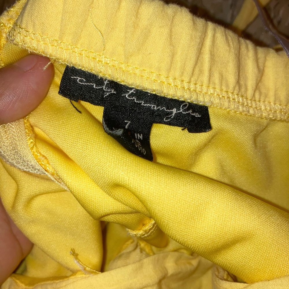 Worn the little string is ripped but dress is great condition